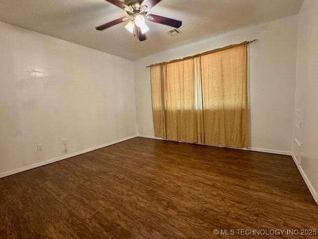 1822 N Xenophon Ave, Tulsa, OK 74127 - spare room with ceiling fan and dark wood-style flooring