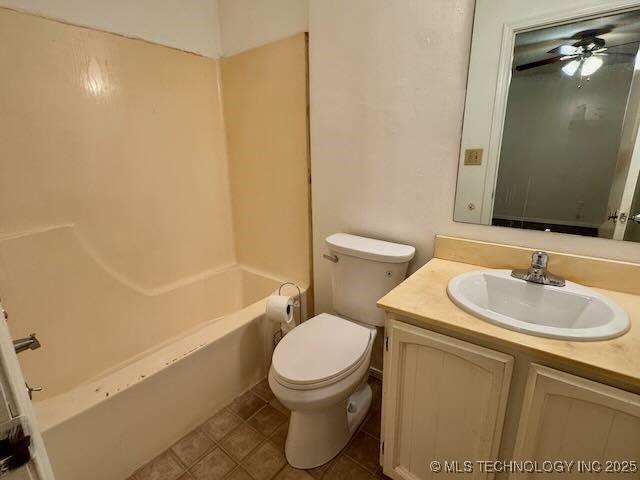 1822 N Xenophon Ave, Tulsa, OK 74127 - bathroom featuring vanity, a ceiling fan, and bathing tub / shower combination