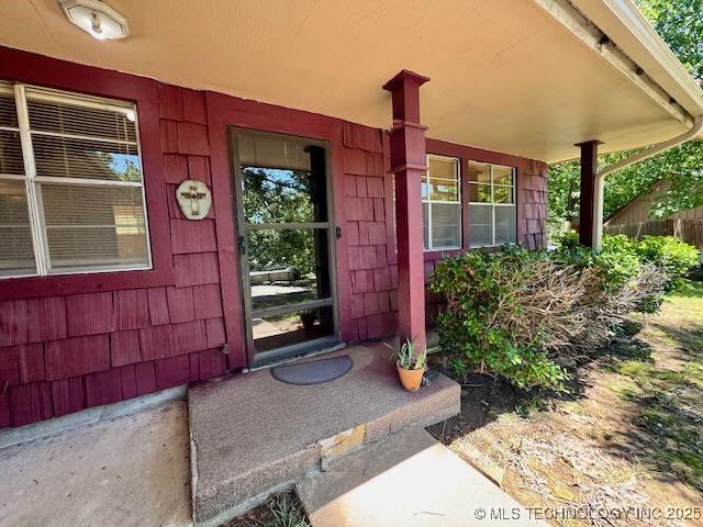 1822 N Xenophon Ave, Tulsa, OK 74127 - view of exterior entry with covered porch
