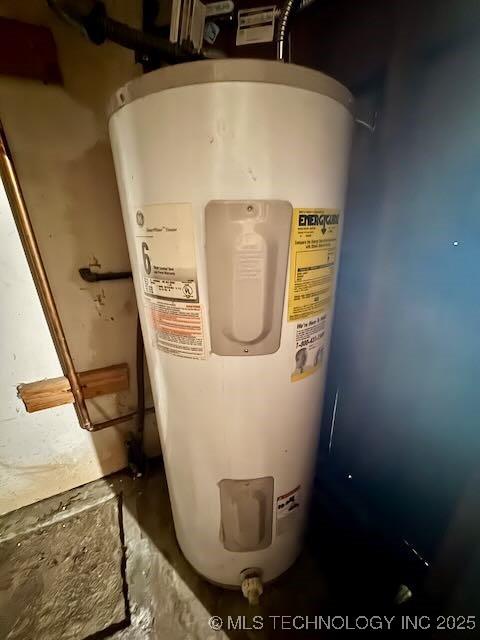 1822 N Xenophon Ave, Tulsa, OK 74127 - detailed view of electric water heater and concrete floors