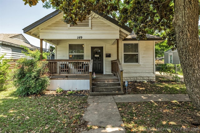 149 N Columbia Pl, Tulsa, OK 74110 - shotgun-style home featuring a porch