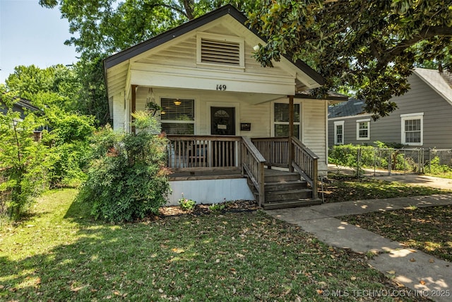 149 N Columbia Pl, Tulsa, OK 74110 - shotgun-style home featuring covered porch