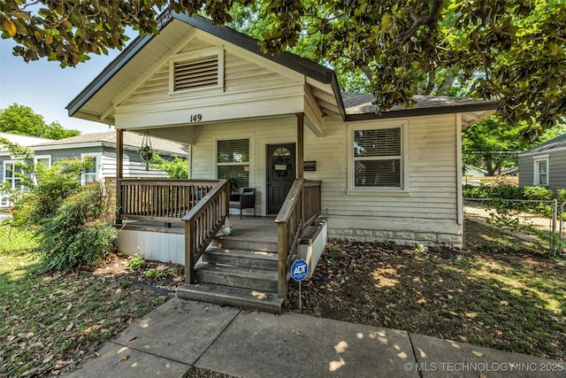 149 N Columbia Pl, Tulsa, OK 74110 - shotgun-style home featuring a porch