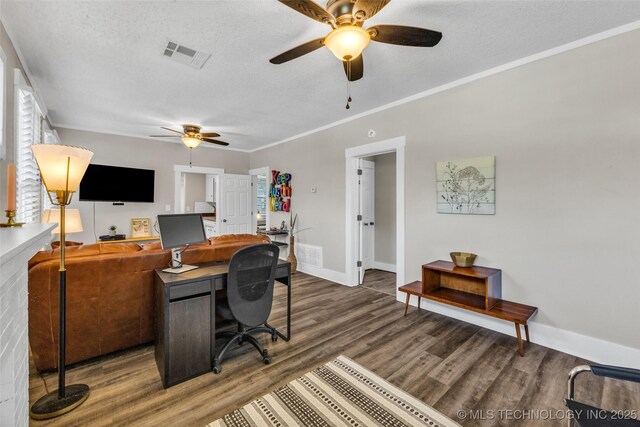 149 N Columbia Pl, Tulsa, OK 74110 - home office featuring ceiling fan, wood finished floors, a textured ceiling, and crown molding