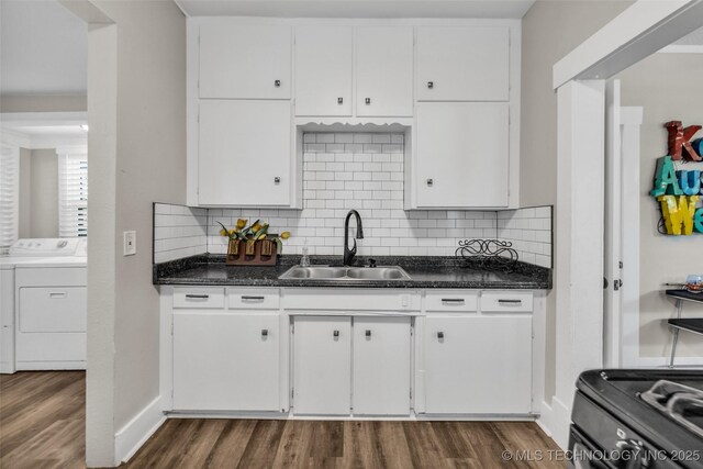 149 N Columbia Pl, Tulsa, OK 74110 - kitchen with washer / clothes dryer, dark wood-style floors, white cabinetry, and dark countertops