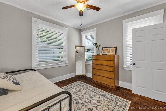 149 N Columbia Pl, Tulsa, OK 74110 - bedroom with wood finished floors, multiple windows, crown molding, and a ceiling fan