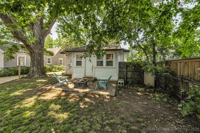 149 N Columbia Pl, Tulsa, OK 74110 - rear view of house with a fire pit and a patio