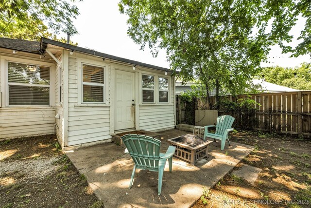 149 N Columbia Pl, Tulsa, OK 74110 - view of patio with a fire pit
