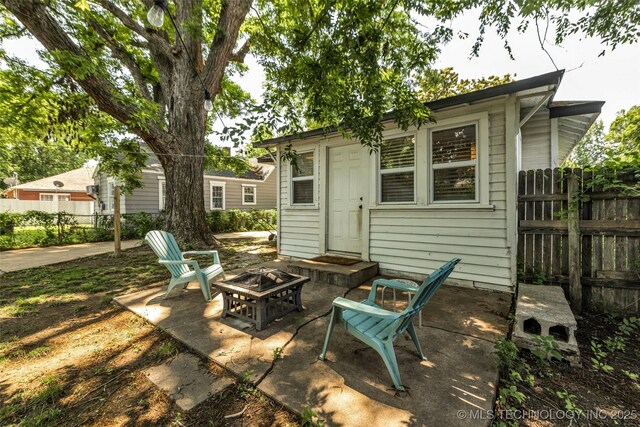 149 N Columbia Pl, Tulsa, OK 74110 - view of patio / terrace with a fire pit