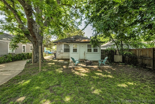 149 N Columbia Pl, Tulsa, OK 74110 - back of property with a fire pit