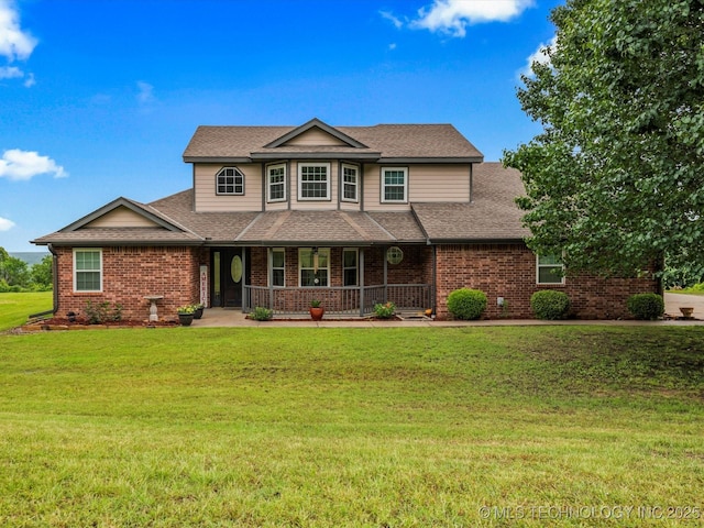 3730 E Mountain Rd, Bartlesville, OK 74003 - view of front of home with covered porch, brick siding, a shingled roof, and a front lawn