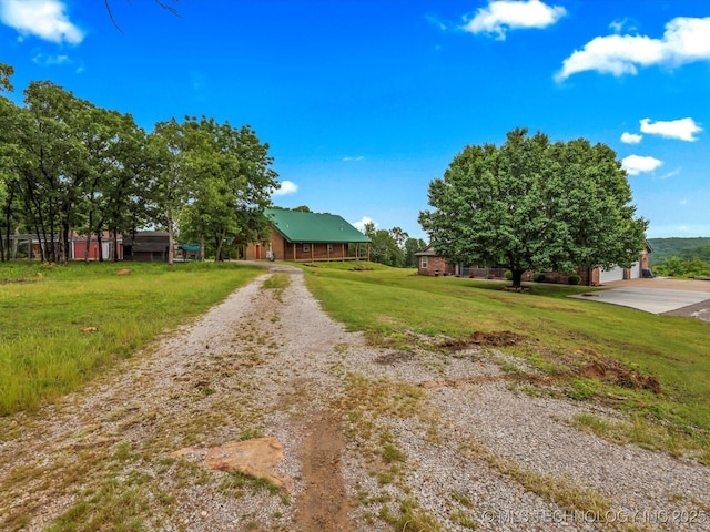 3730 E Mountain Rd, Bartlesville, OK 74003 - view of front facade with driveway and a front lawn