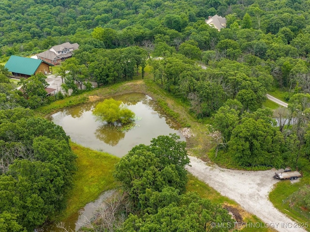 3730 E Mountain Rd, Bartlesville, OK 74003 - aerial view of property and surrounding area with a heavily wooded area and a large body of water