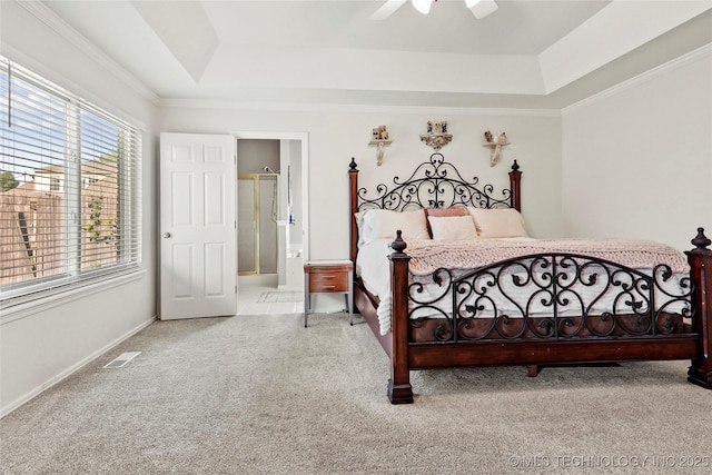 812 N Butternut Ave, Broken Arrow, OK 74012 - bedroom featuring a raised ceiling, carpet flooring, connected bathroom, a ceiling fan, and crown molding
