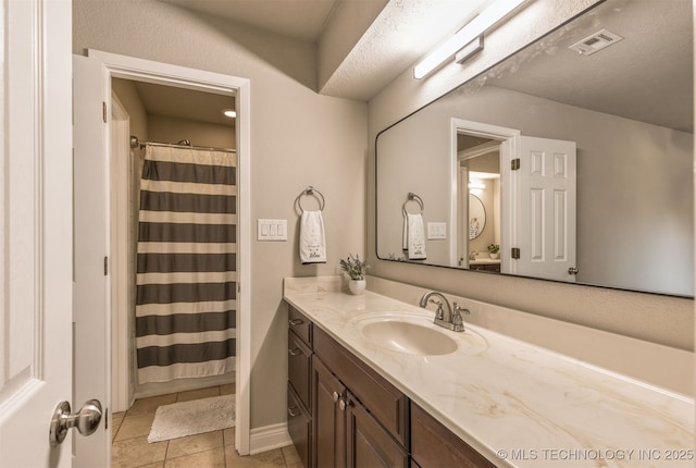 6376 S 80th E Ave Unit 41H, Tulsa, OK 74133 - bathroom featuring vanity, tile patterned flooring, and a shower with shower curtain