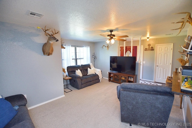 18185 Hilltop Cir, Tahlequah, OK 74464 - living room featuring a ceiling fan, carpet floors, and a textured ceiling
