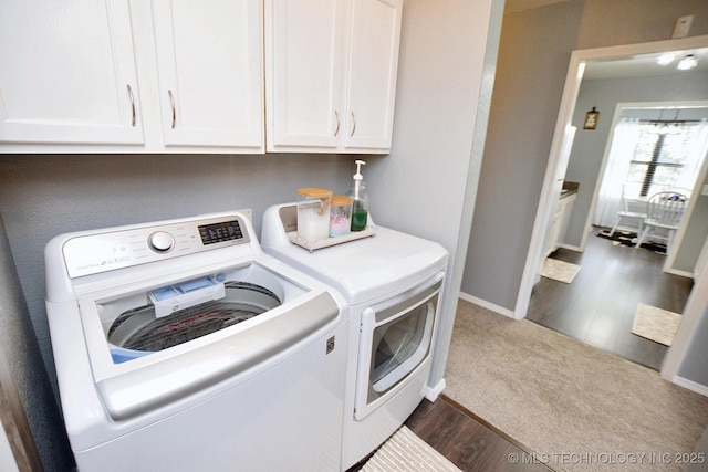 18185 Hilltop Cir, Tahlequah, OK 74464 - laundry room with washing machine and dryer, cabinet space, dark wood-type flooring, and dark carpet