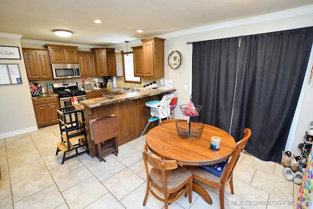 21887 Coffee Hollow Rd, Tahlequah, OK 74464 - kitchen with appliances with stainless steel finishes, crown molding, a peninsula, brown cabinets, and tasteful backsplash