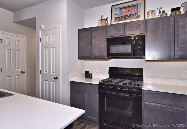 606 Georgia Pl, Muskogee, OK 74403 - kitchen with black appliances, light countertops, and dark brown cabinets