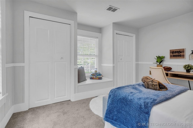 408 K SW, Ardmore, OK 73401 - carpeted bedroom featuring two closets