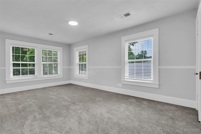 408 K SW, Ardmore, OK 73401 - spare room featuring healthy amount of natural light and carpet floors