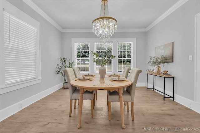 408 K SW, Ardmore, OK 73401 - dining space featuring light wood finished floors, a chandelier, and ornamental molding