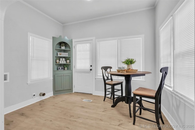 408 K SW, Ardmore, OK 73401 - dining area featuring ornamental molding and light wood finished floors