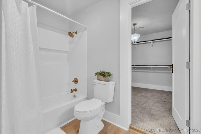 408 K SW, Ardmore, OK 73401 - bathroom featuring shower / bath combo and a spacious closet