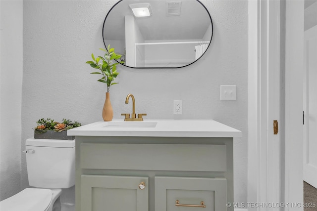 408 K SW, Ardmore, OK 73401 - bathroom featuring vanity and a textured wall