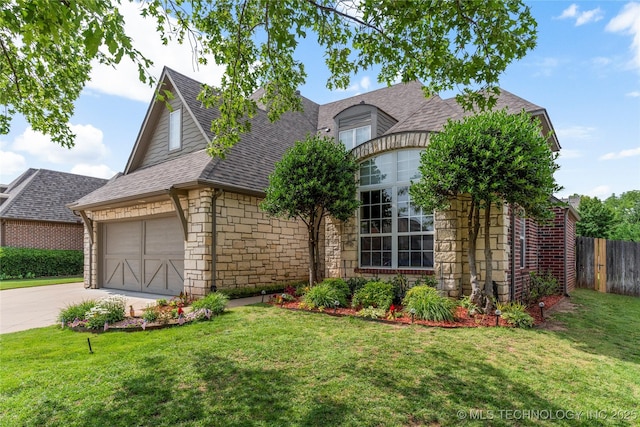 8811 E 110th St S, Bixby, OK 74133 - view of front of home with stone siding, concrete driveway, a garage, and a shingled roof