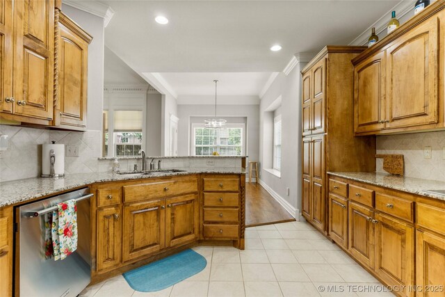 8811 E 110th St S, Bixby, OK 74133 - kitchen with dishwasher, tasteful backsplash, light stone counters, brown cabinetry, and a peninsula