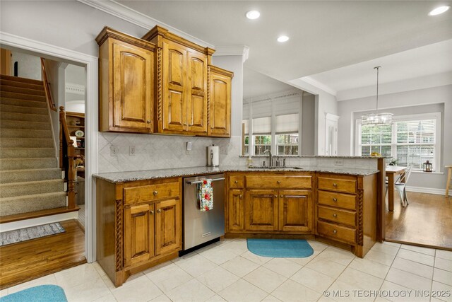8811 E 110th St S, Bixby, OK 74133 - kitchen featuring dishwasher, brown cabinets, light stone counters, recessed lighting, and a peninsula