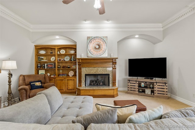 8811 E 110th St S, Bixby, OK 74133 - living area with crown molding, a ceiling fan, light colored carpet, and a fireplace