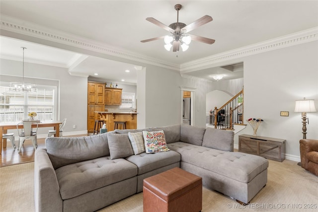 8811 E 110th St S, Bixby, OK 74133 - living room featuring stairs, a ceiling fan, crown molding, a chandelier, and recessed lighting