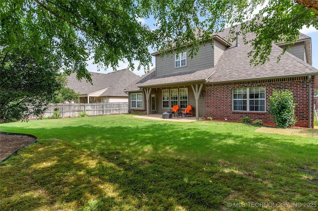 8811 E 110th St S, Bixby, OK 74133 - rear view of house featuring a patio, brick siding, and a shingled roof