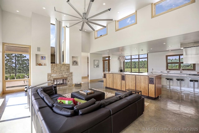 421403 E 1920th Rd, Antlers, OK 74523 - living area with a towering ceiling and a stone fireplace