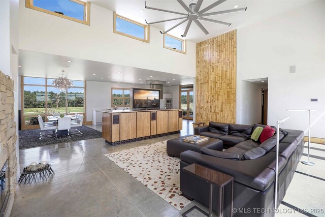 421403 E 1920th Rd, Antlers, OK 74523 - living room featuring a high ceiling, ceiling fan, and a chandelier