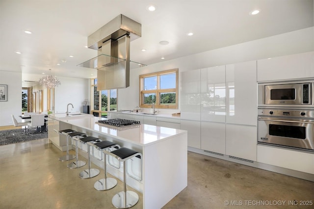 421403 E 1920th Rd, Antlers, OK 74523 - kitchen featuring stainless steel appliances, finished concrete flooring, a chandelier, white cabinetry, and recessed lighting