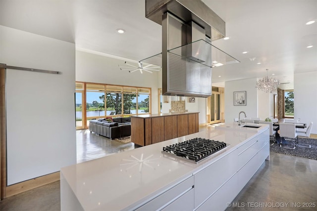 421403 E 1920th Rd, Antlers, OK 74523 - kitchen with stainless steel gas cooktop, modern cabinets, recessed lighting, a chandelier, and open floor plan
