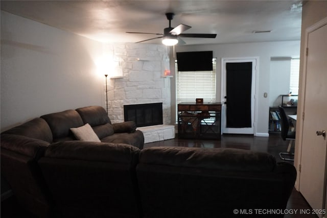 7817 N 122nd E Ave, Owasso, OK 74055 - living area with ceiling fan, a fireplace, and dark wood-type flooring