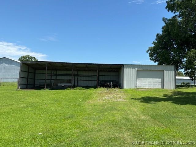 902 NE Rushwood Dr, Stigler, OK 74462 - view of pole building featuring a lawn