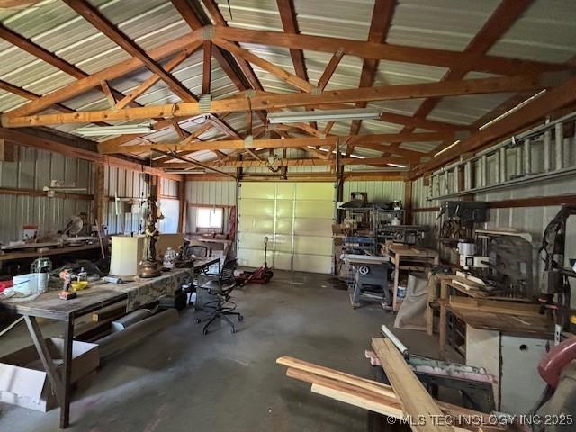 902 NE Rushwood Dr, Stigler, OK 74462 - garage featuring a workshop area