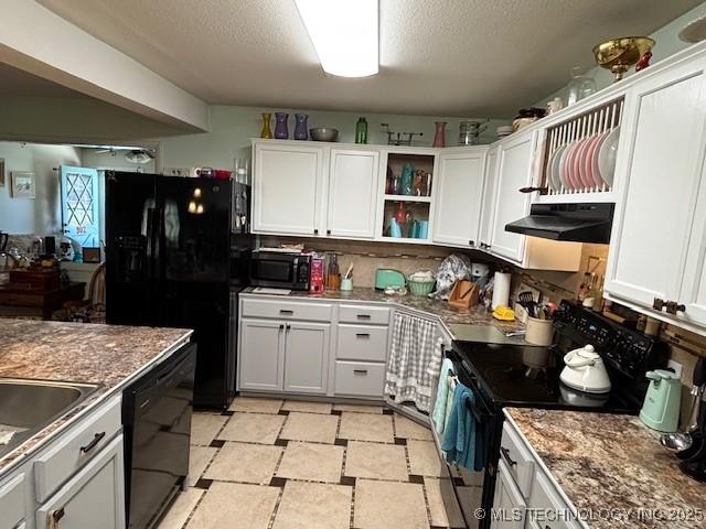 902 NE Rushwood Dr, Stigler, OK 74462 - kitchen featuring black appliances, under cabinet range hood, white cabinetry, open shelves, and a textured ceiling