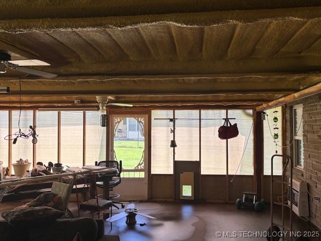 902 NE Rushwood Dr, Stigler, OK 74462 - sunroom / solarium featuring heating unit