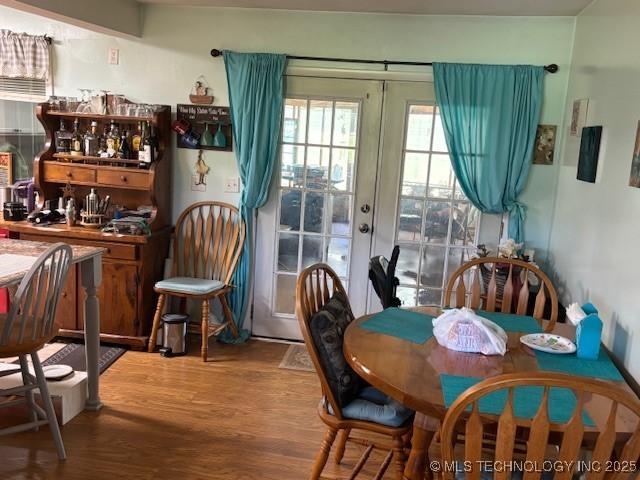 902 NE Rushwood Dr, Stigler, OK 74462 - dining space featuring wood finished floors and french doors