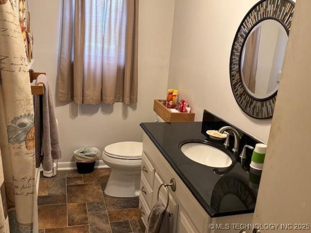 902 NE Rushwood Dr, Stigler, OK 74462 - bathroom with vanity and stone finish floors