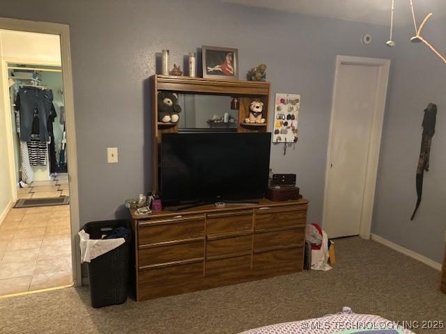 902 NE Rushwood Dr, Stigler, OK 74462 - bedroom with light carpet and baseboards