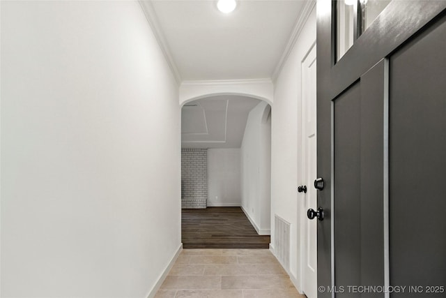 10062 E Northshire St, Claremore, OK 74017 - corridor with arched walkways, crown molding, and light tile patterned floors