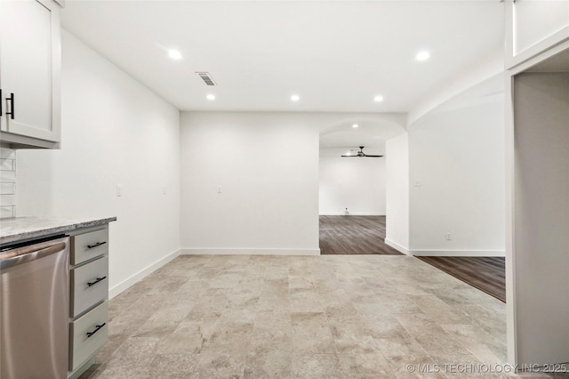 10062 E Northshire St, Claremore, OK 74017 - kitchen featuring dishwasher, recessed lighting, ceiling fan, light stone counters, and open floor plan