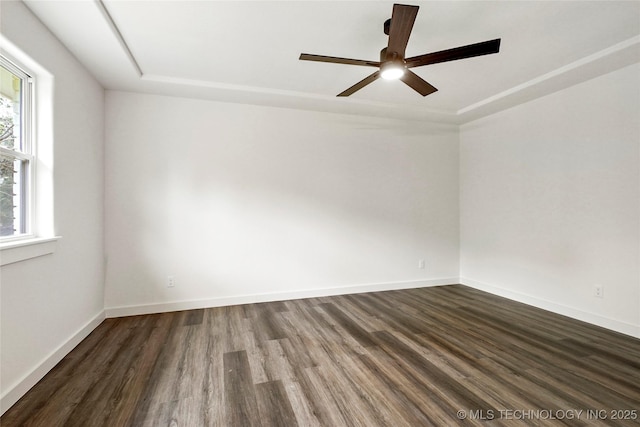 10062 E Northshire St, Claremore, OK 74017 - unfurnished room with dark wood-style floors, ceiling fan, and a tray ceiling